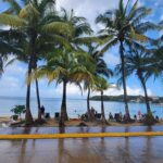 Beachfront scenery at West End in Roatan, Honduras, with turquoise waters