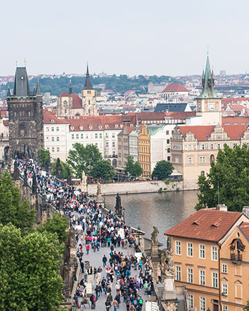 Historic skyline of Prague, Czech Republic with Charles Bridge and red rooftops